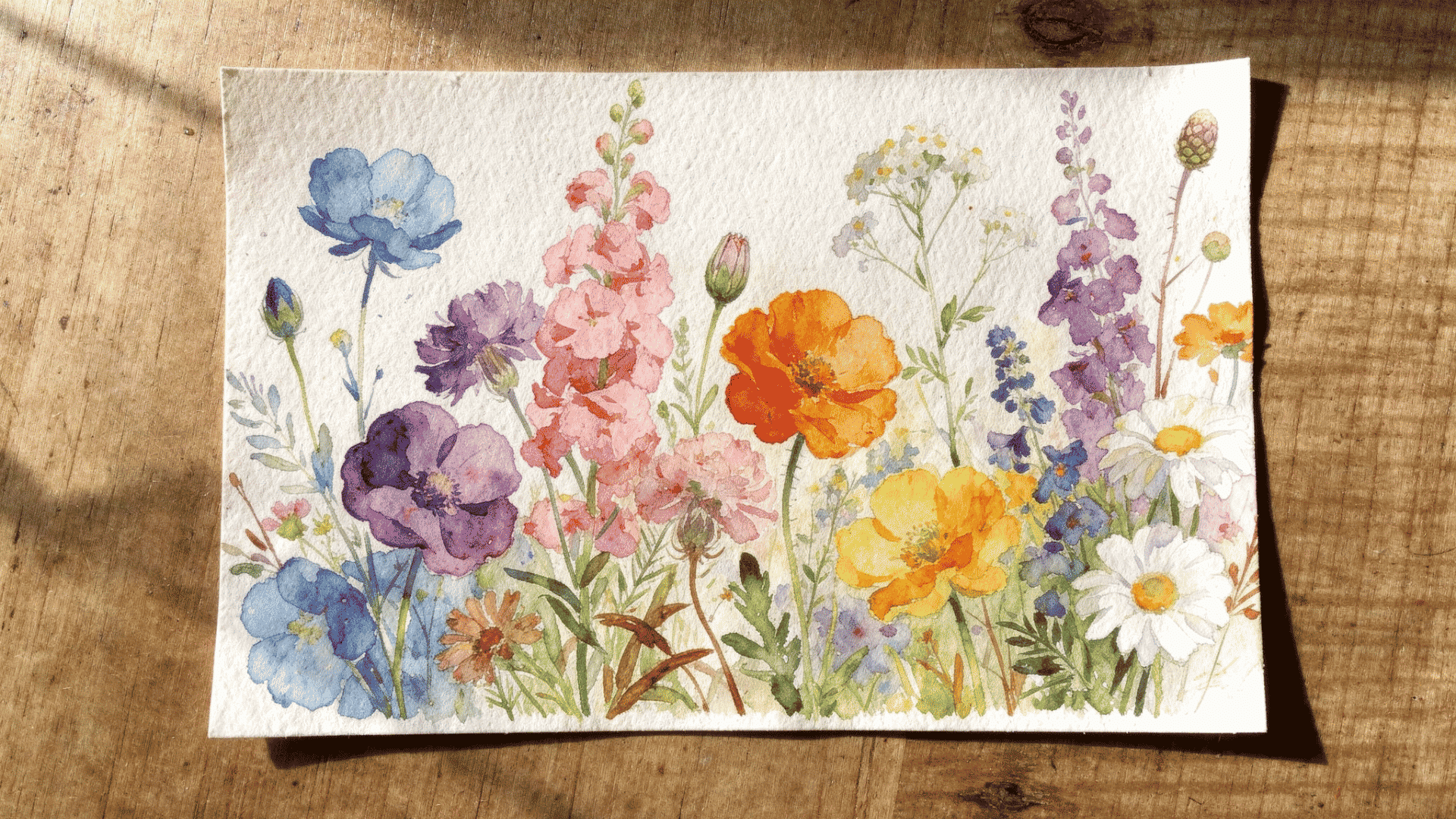 Watercolor flowers are floral paintings made with water-based pigments that create soft color blends.